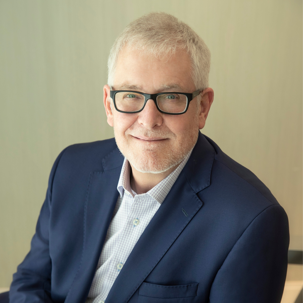 A professional headshot of dr. Jim Bates