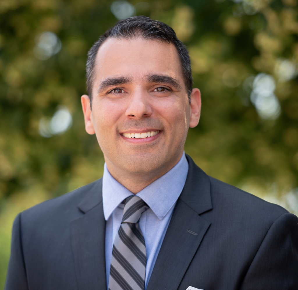 A professional headshot of dr. Kam Giglou