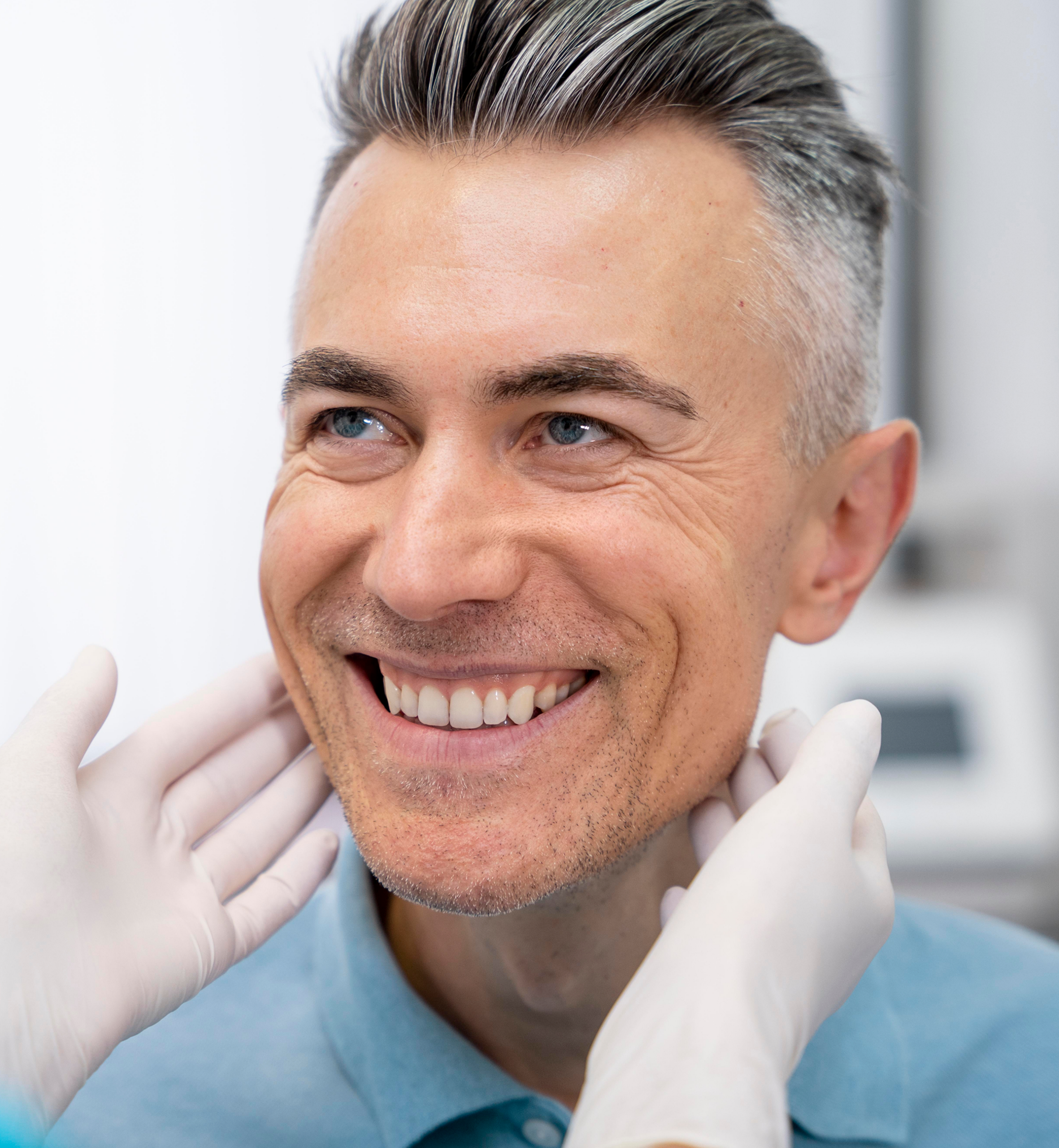 Patient receiving a post-operative evaluation after oral surgery treatment